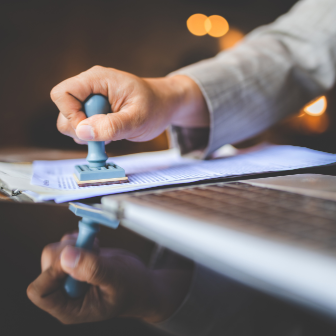 businessman approving a document